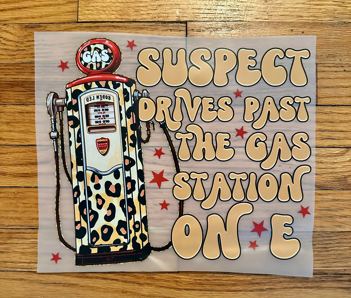 Suspect drives past the gas station on E