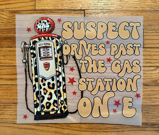 Suspect drives past the gas station on E